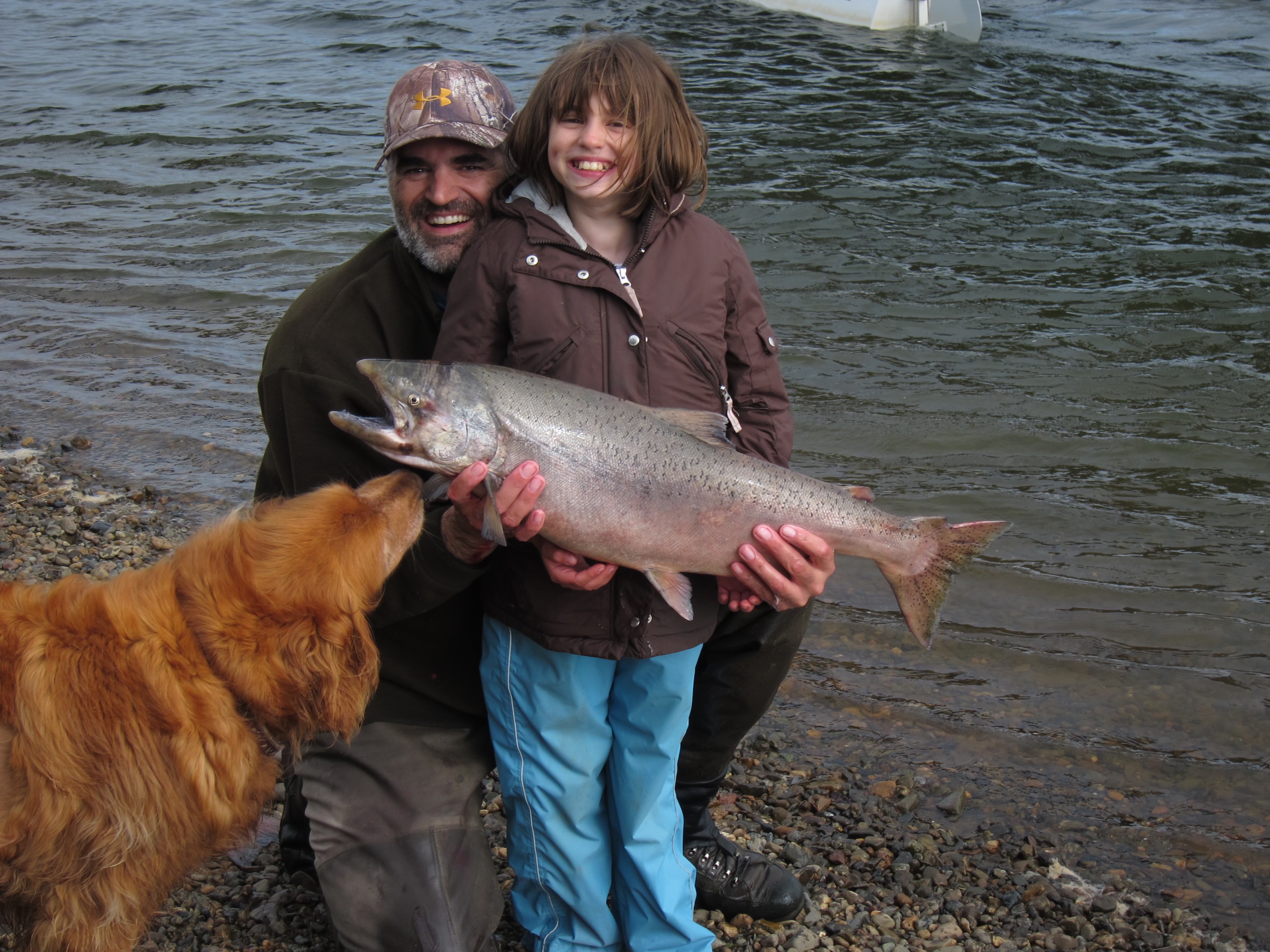 Mary Reinbold '25 and her dad holding a freshly caught King Salmon on the Nushagak River in Alaska in Summer 2011. Photo provided by Reinbold.