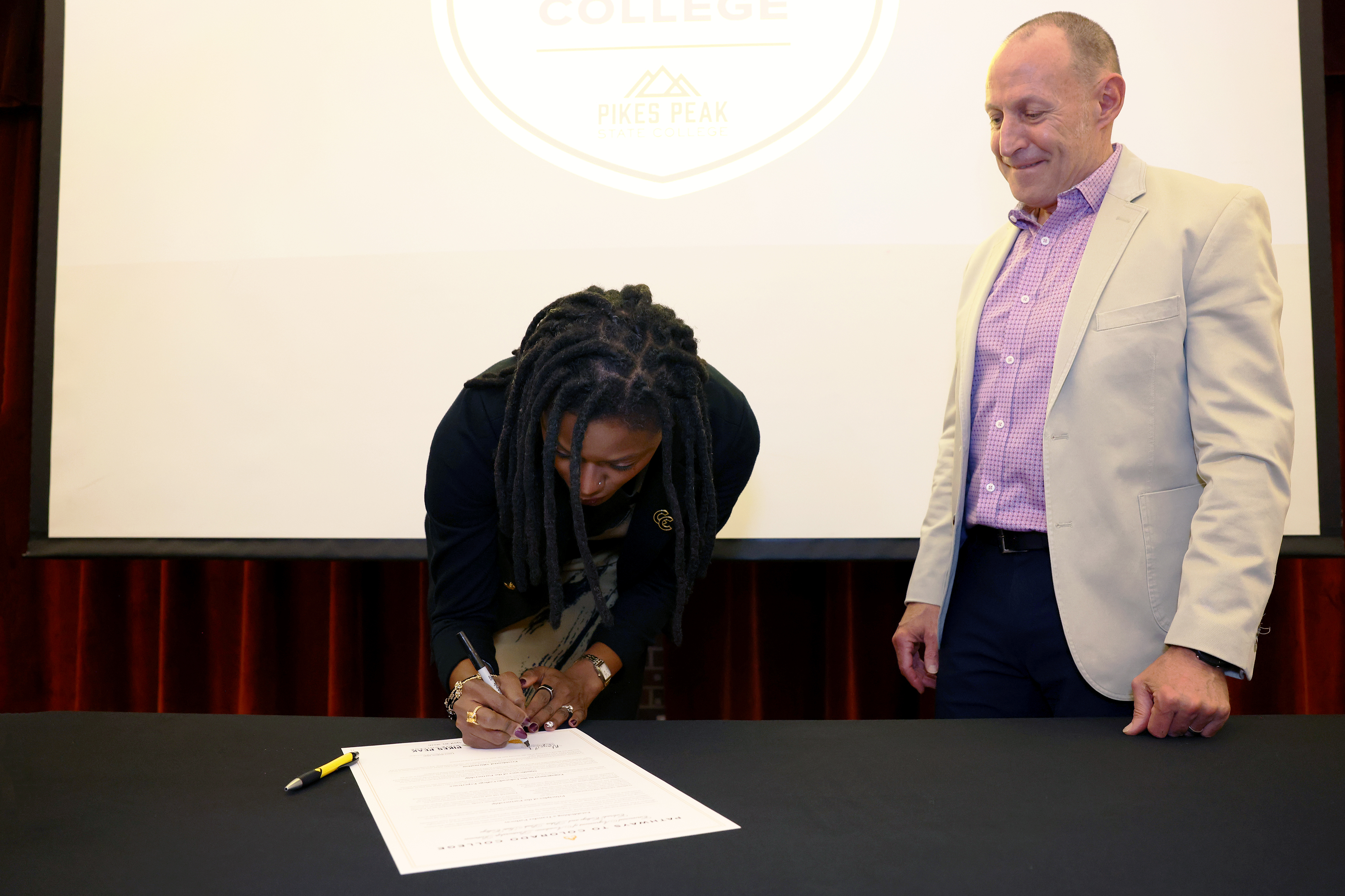 CC President Manya Whitaker signs the transfer pathway agreement certificate on April 30, 2026 at Gaylord Hall. Photo by Jamie Cotten / Colorado College
