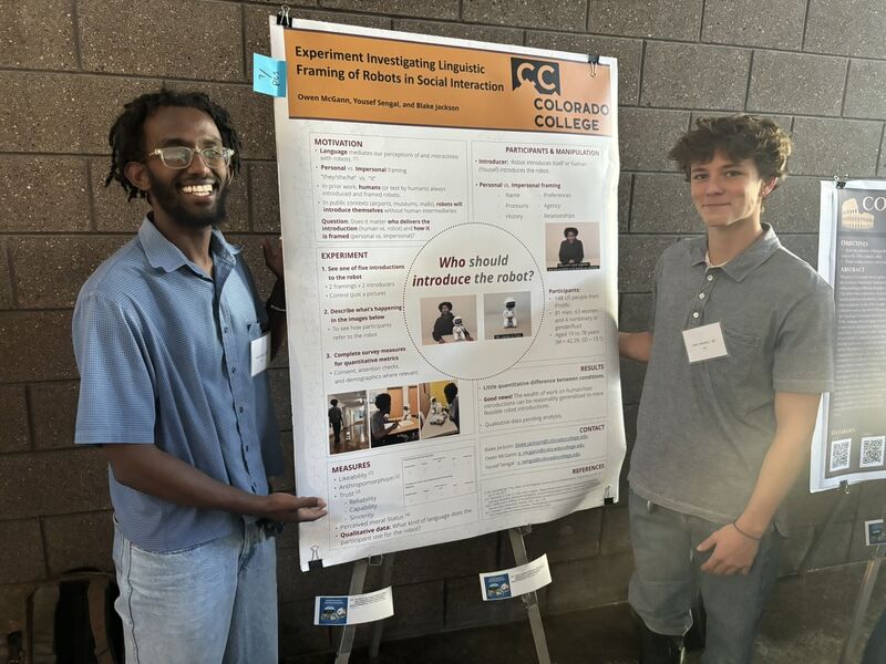 Yousef Sengal ’27 (L) and Owen McGann ’26 (R) present their research on Human-Robot Interaction (HRI) entitled, “You Never Get a Second Chance to Make a First Impression: Using Introductions to Frame Mental Models of Social Robots,” at the September 2025 Summer Faculty-Student Collaborative Research and Internship Symposium. Photo provided by McGann