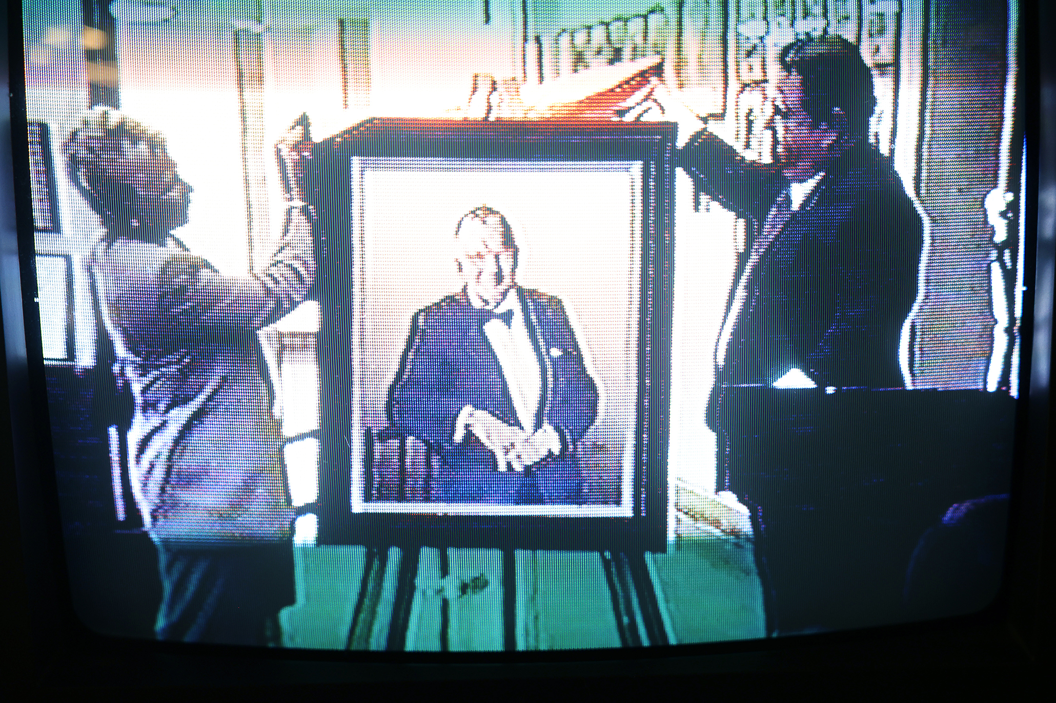 A still shot taken from a video of the dedication of the George Lyon Memorial, March 11, 1994, at El Pomar Sports Center showing George and Pat Lyon unveiling the portrait. Courtesy CC Special Collections