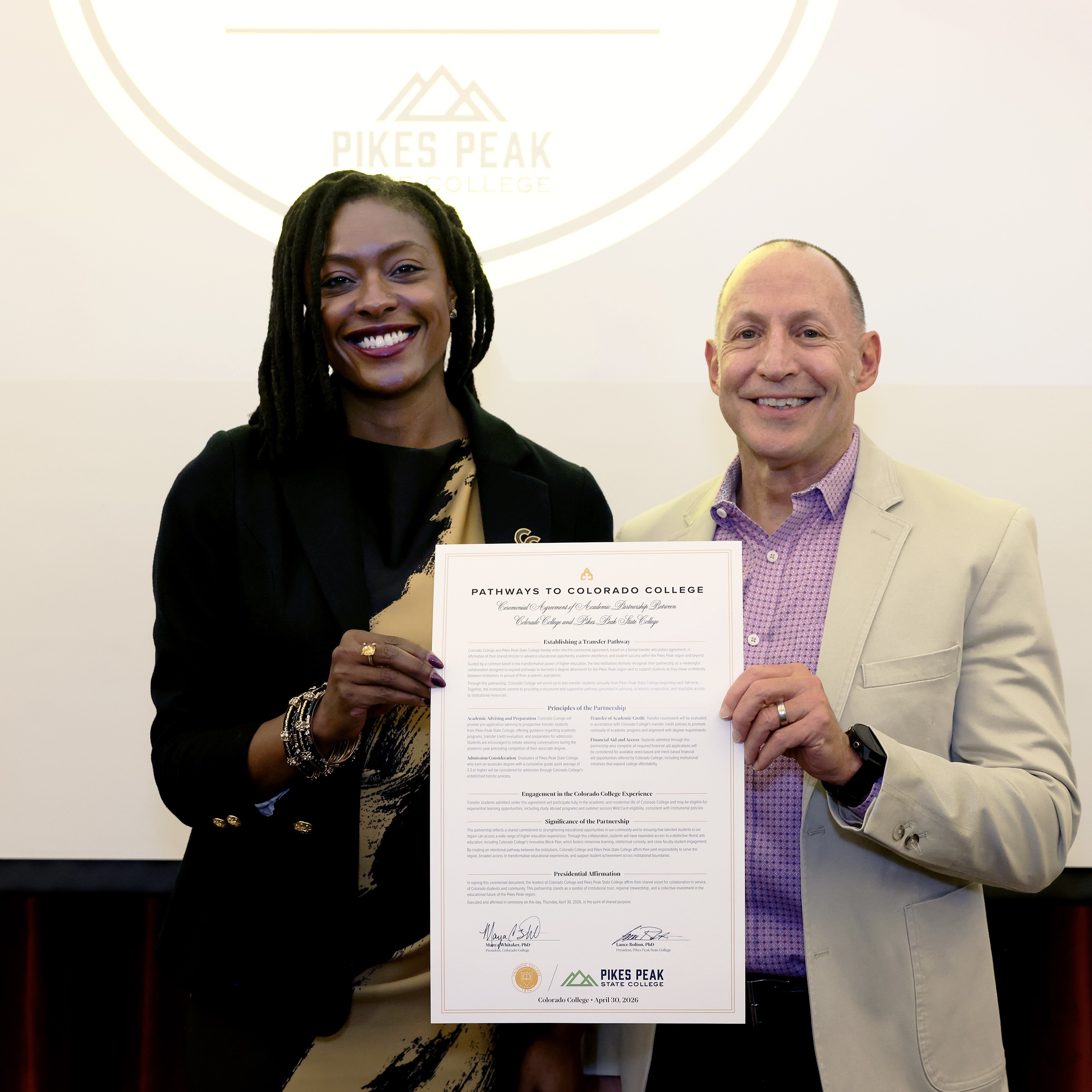 Colorado College President Manya Whitaker and Pikes Peak State College President Lance Bolton hold the signed articulation agreement certificate committing to the Pathways to Colorado College, PPSC Transfer Pathway. Photo by Jamie Cotten / Colorado College