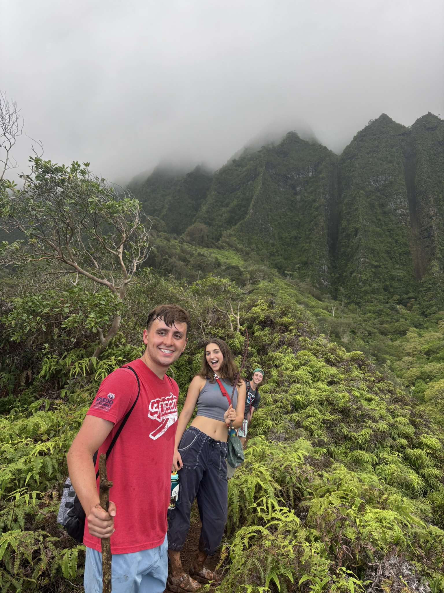 Kole Petersen '27, Avy Diamond '26, and Thomas Nielsen '26 hiking to Maunawili Falls in Oahu, Hawaii, on March 4, 2026. Photo provided by Peterson