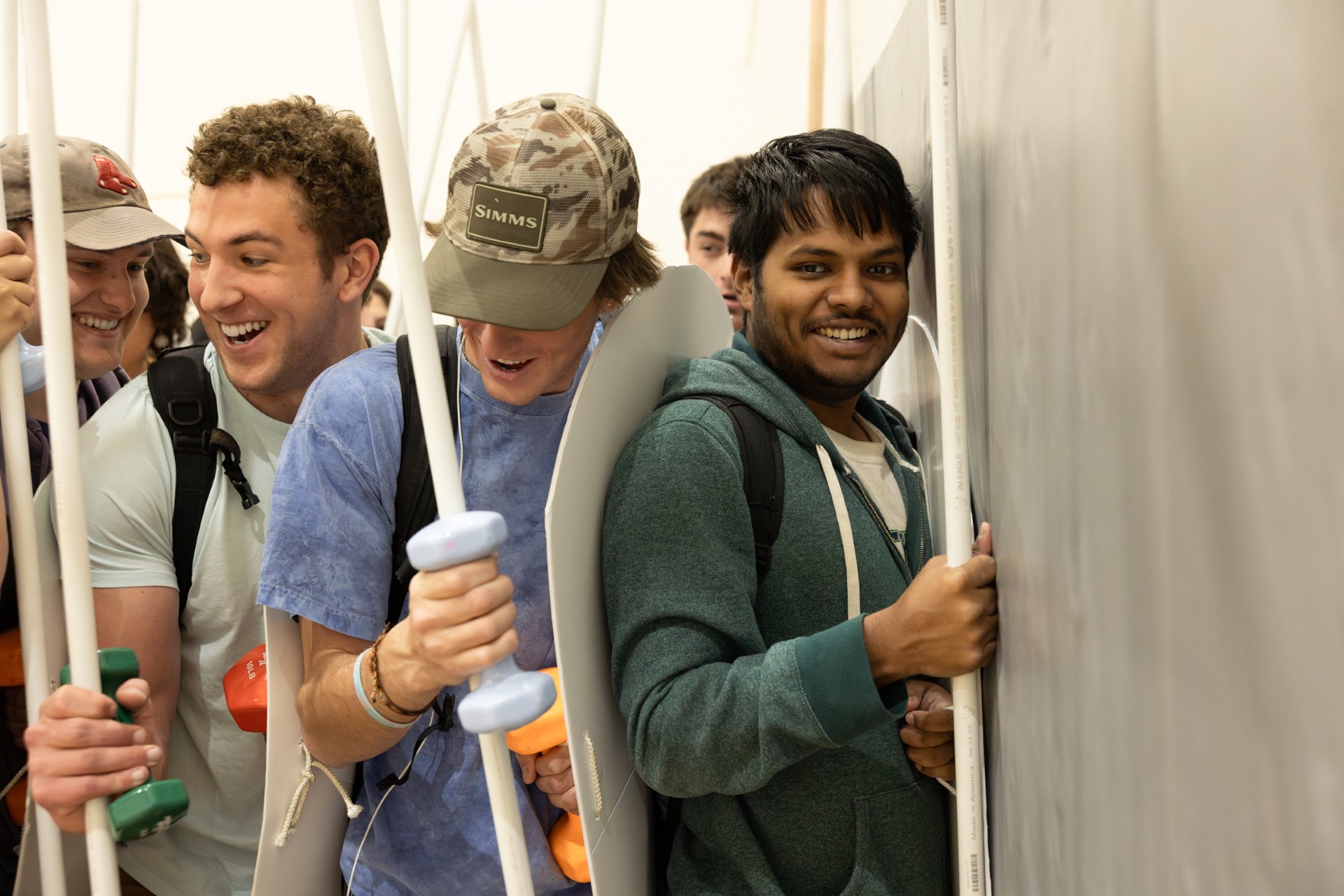 Students in Associate Professor and Chair of Classics Dr. Richard Fernando Buxton's Warfare in Greece and Rome Spring 2024 class simulate wielding ancient Roman and Greek armor, which would often weight over 60 pounds. Photo by Eileen Broderick.